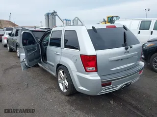 2007 Jeep Grand Cherokee SRT-8 with VIN 1J8HR78367C649237, listed as a IAAI auction lot 42019555 with 101,967 mi miles. Bid and sale history available at carsss.com. Image 3.