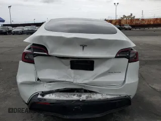 2021 Tesla Model Y Long Range with VIN 5YJYGDEEXMF151686, listed as a Copart auction lot 53903115 with 65,321 mi miles and Salvage Title. Bid and sale history available at DreamBid. Image 6.