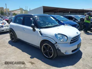 2016 MINI Countryman with VIN WMWZB3C5XGWM33386, listed as a IAAI auction lot 42619777 with 80,655 mi miles and . Bid and sale history available at DreamBid. Image 1.