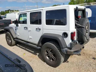 2016 Jeep Wrangler Unlimited Sahara with VIN 1C4BJWEG1GL328101, listed as a Copart auction lot 52754865 with 65,106 mi miles and Salvage title. Bid and sale history available at DreamBid. Image 2.