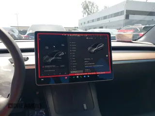 2022 Tesla Model 3 with VIN 5YJ3E1EA0NF344782, listed as a IAAI auction lot 41803469 with 16,973 mi miles and . Bid and sale history available at DreamBid. Image 18.