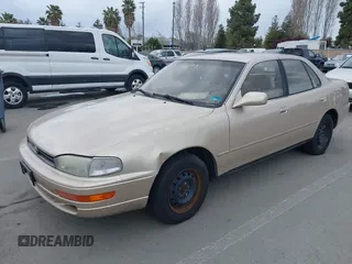 1994 Toyota Camry LE with VIN JT2SK12E0R0269820, listed as a IAAI auction lot 41908360 with 184,739 mi miles. Bid and sale history available at carsss.com. Image 2.