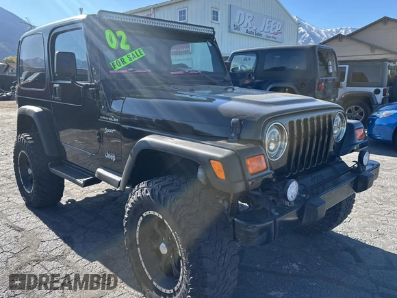 2002 Jeep Wrangler Sport with VIN 1J4FA49S32P765579, listed as a Copart auction lot 55244845 with 127,791 mi miles and Clean Title. Bid and sale history available at carsss.com. Image 1.