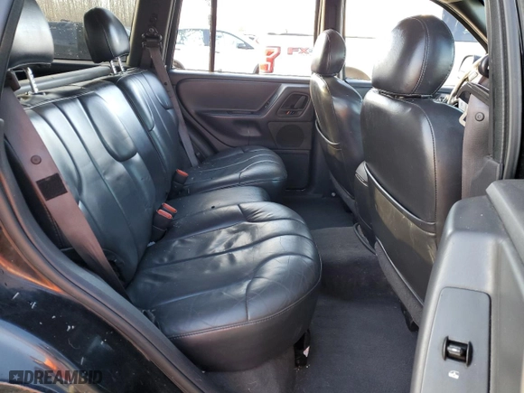 1999 Jeep Grand Cherokee Laredo with VIN 1J4GW58N1XC737706, listed as a Copart auction lot 83107914 with 0 mi miles and Salvage Title. Bid and sale history available at carsss.com. Image 12.