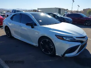 2022 Toyota Camry TRD with VIN 4T1KZ1AK0NU064491, listed as a IAAI auction lot 41673941 with 50,138 mi miles and . Bid and sale history available at DreamBid. Image 1.