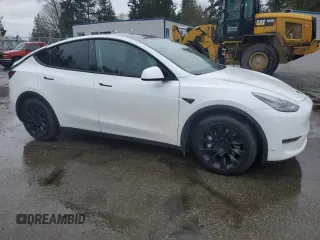 2021 Tesla Model Y Long Range with VIN 5YJYGAEE2MF115988, listed as a Copart auction lot 52206535 with 53,911 mi miles and Salvage Title. Bid and sale history available at DreamBid. Image 4.