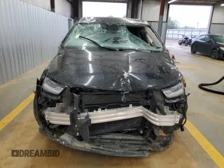 2023 Chrysler Pacifica Touring L with VIN 2C4RC1BG3PR582271, listed as a Copart auction lot 51644595 with 57,930 mi miles and Salvage title. Bid and sale history available at DreamBid. Image 5.