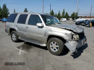 2000 Cadillac Escalade z VIN 1GYEK63R8YR228214, wystawiony jako Copart lot #73567434 z przebiegiem 235 399 mil mil oraz Szkody całkowita. Historia ofert i sprzedaży dostępna na DreamBid. Obrazek 4.
