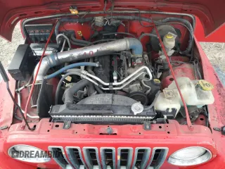 2005 Jeep Wrangler X z VIN 1J4FA39S15P337816, wystawiony jako Copart lot #55957725 z przebiegiem 107 030 mil mil oraz Szkoda całkowita • Salvage title. Historia ofert i sprzedaży dostępna na DreamBid. Obrazek 11.