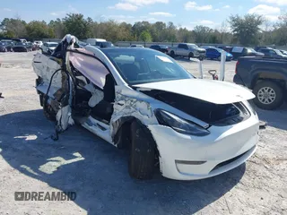 2023 Tesla Model Y Long Range with VIN 7SAYGAEE1PF665934, listed as a IAAI auction lot 41780949 with 21,949 mi miles and . Bid and sale history available at DreamBid. Image 1.