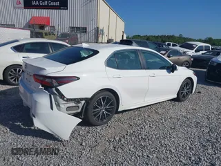 2023 Toyota Camry SE with VIN 4T1G11AKXPU768990, listed as a IAAI auction lot 42118544 with 53,064 mi miles. Bid and sale history available at carsss.com. Image 4.