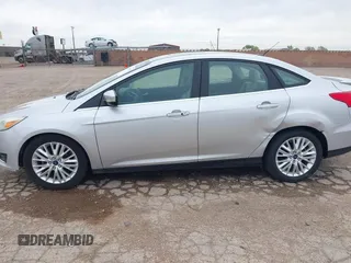 2017 Ford Focus Titanium with VIN 1FADP3J24HL229702, listed as a IAAI auction lot 42057013 with 120,250 mi miles and . Bid and sale history available at DreamBid. Image 14.