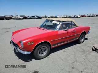 1970 FIAT 124 Spider with VIN 0032004, listed as a Copart auction lot 64121715 with 35,989 mi miles and Clean title. Bid and sale history available at DreamBid. Image 1.