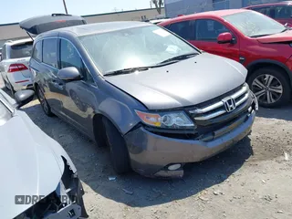 2016 Honda Odyssey Touring Elite z VIN 5FNRL5H97GB149967, wystawiony jako IAAI lot #42256512 z przebiegiem 109 855 mil mil oraz . Historia ofert i sprzedaży dostępna na DreamBid. Obrazek 1.