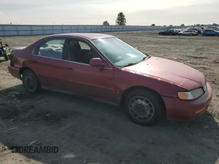 1996 Honda Accord LX with VIN 1HGCD563XTA266206, listed as a Copart auction lot 48601005 with 302,329 mi miles and Salvage Title. Bid and sale history available at DreamBid. Image 4.