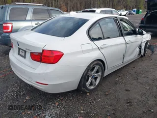 2015 BMW 3 Series 328i xDrive with VIN WBA3B5G59FNS19005, listed as a IAAI auction lot 41570070 with 104,666 mi miles. Bid and sale history available at carsss.com. Image 4.