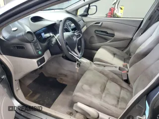2013 Honda Insight z VIN JHMZE2H36DS002170, wystawiony jako Copart lot #56276445 z przebiegiem 197 871 mil mil oraz Czysty tytuł • Clean title. Historia ofert i sprzedaży dostępna na DreamBid. Obrazek 7.