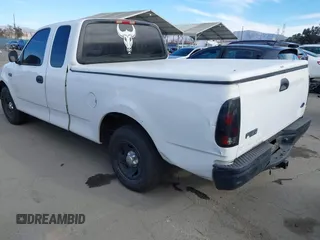 2000 Ford F-150 XL with VIN 1FTZX1727YKA78887, listed as a IAAI auction lot 41291272 with 289,343 mi miles. Bid and sale history available at carsss.com. Image 3.
