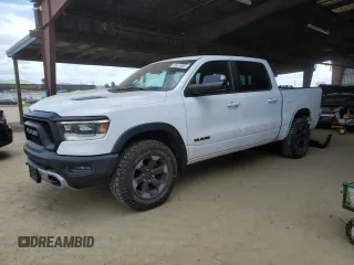 2019 Ram 1500 Rebel z VIN 1C6SRFLTXKN618849, wystawiony jako Copart lot #50419595 z przebiegiem 98 219 mil mil oraz Szkoda całkowita • Salvage title. Historia ofert i sprzedaży dostępna na DreamBid. Obrazek 1.
