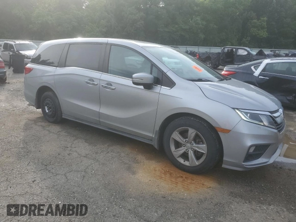 2018 Honda Odyssey EX-L with VIN 5FNRL6H74JB099282, listed as a Copart auction lot 55031025 with 137,359 mi miles and Salvage Title. Bid and sale history available at DreamBid. Image 4.