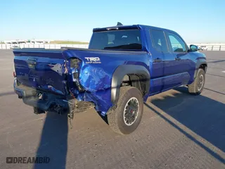 2024 Toyota Tacoma 4WD SR5 with VIN 3TYLB5JN3RT028338, listed as a IAAI auction lot 41870958 with 2,249 mi miles. Bid and sale history available at carsss.com. Image 4.