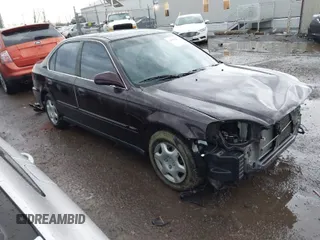 2000 Honda Civic EX with VIN 1HGEJ8644YL037589, listed as a IAAI auction lot 41891907 with 127,086 mi miles. Bid and sale history available at carsss.com. Image 1.