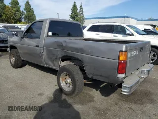 1987 Nissan Hardbody E z VIN JN6ND11SXHW014073, wystawiony jako Copart lot #78956934 z przebiegiem 381 885 mil mil oraz Szkody całkowita. Historia ofert i sprzedaży dostępna na DreamBid. Obrazek 2.