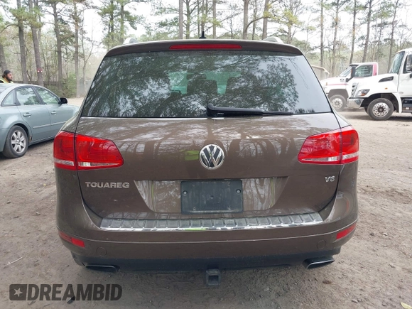 2014 Volkswagen Touareg Sport with VIN WVGEF9BP2ED007904, listed as a IAAI auction lot 41960811 with 126,230 mi miles and . Bid and sale history available at DreamBid. Image 16.