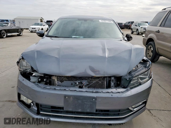 2016 Volkswagen Passat SE с VIN 1VWBT7A36GC004710, выставлен на аукционе Copart как лот 47977765 с пробегом Не указан миль и Списание • Salvage title. История ставок и продаж доступна на DreamBid. Изображение 5.