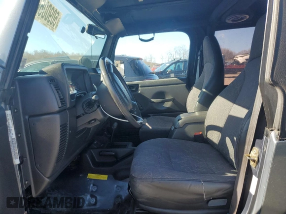 2002 Jeep Wrangler Sport with VIN 1J4FA49S22P703610, listed as a Copart auction lot 50900605 with 70,045 mi miles and Salvage Title. Bid and sale history available at carsss.com. Image 7.