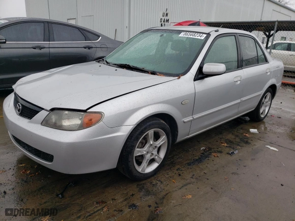 2003 Mazda Protege DX with VIN JM1BJ225731208014, listed as a Copart auction lot 86568234 with 275,867 mi miles and Salvage Title. Bid and sale history available at carsss.com. Image 1.