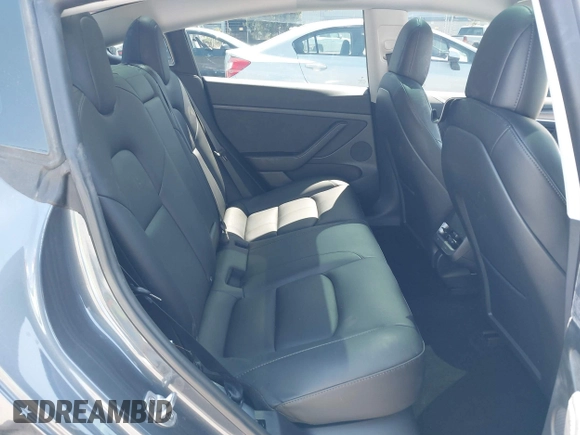 2023 Tesla Model 3 with VIN 5YJ3E1EAXPF405588, listed as a IAAI auction lot 42348952 with 30,788 mi miles and . Bid and sale history available at DreamBid. Image 8.