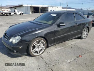 2009 Mercedes-Benz CLK 550 with VIN WDBTJ72H69F266105, listed as a Copart auction lot 79723224 with 114,840 mi miles and Salvage Title. Bid and sale history available at DreamBid. Image 1.