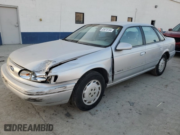 1995 Ford Taurus GL with VIN 1FALP52U5SA320424, listed as a Copart auction lot 83676194 with 177,817 mi miles and Salvage title. Bid and sale history available at DreamBid. Image 1.