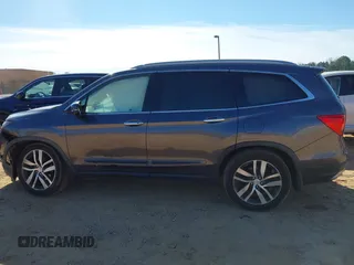 2017 Honda Pilot Touring with VIN 5FNYF5H92HB038893, listed as a IAAI auction lot 41639555 with 100,354 mi miles. Bid and sale history available at carsss.com. Image 14.