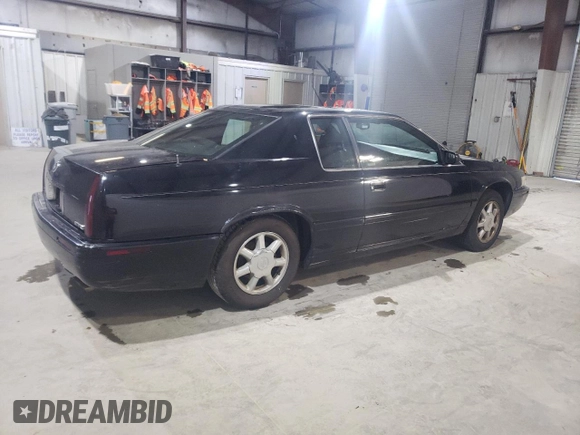 2000 Cadillac Eldorado Touring ETC z VIN 1G6ET1294YU144883, wystawiony jako Copart lot #80979854 z przebiegiem 89 271 mil mil oraz Czysty tytuł • Clean title. Historia ofert i sprzedaży dostępna na DreamBid. Obrazek 3.