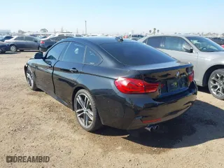2019 BMW 4 Series 430i with VIN WBA4J1C56KBM13749, listed as a IAAI auction lot 41849287 with 54,607 mi miles. Bid and sale history available at carsss.com. Image 3.