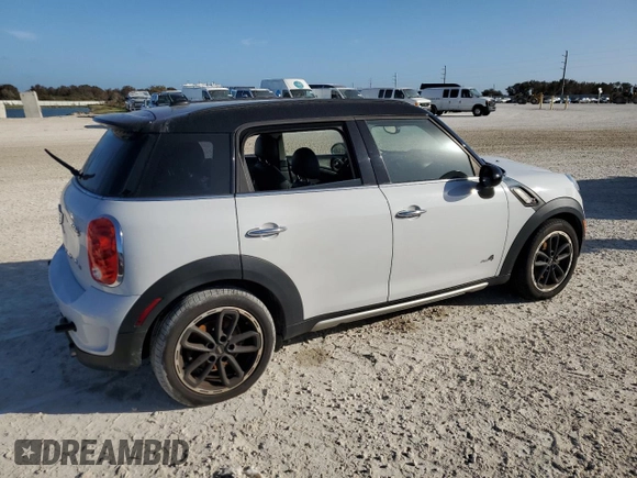 2016 MINI Countryman S with VIN WMWZC5C51GWU01290, listed as a Copart auction lot 77684384 with 106,811 mi miles and Salvage Title. Bid and sale history available at DreamBid. Image 3.