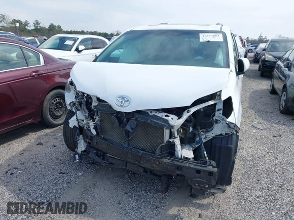 2015 Toyota Sienna SE with VIN 5TDXK3DC4FS566084, listed as a IAAI auction lot 41777561 with 153,002 mi miles and . Bid and sale history available at carsss.com. Image 6.