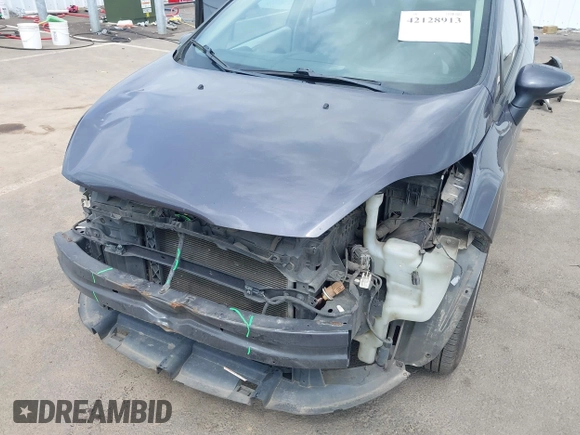 2013 Ford Fiesta SE z VIN 3FADP4BJ3DM186569, wystawiony jako IAAI lot #42128913 z przebiegiem 19 228 mil mil oraz . Historia ofert i sprzedaży dostępna na DreamBid. Obrazek 6.