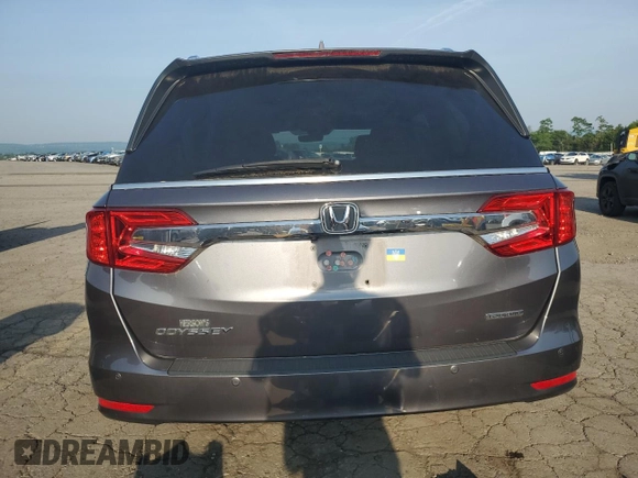 2018 Honda Odyssey Touring с VIN 5FNRL6H83JB009998, выставлен на аукционе Copart как лот 60616695 с пробегом 101 880 миль миль и Списание • Salvage title. История ставок и продаж доступна на DreamBid. Изображение 6.