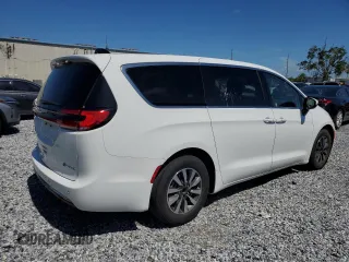 2023 Chrysler Pacifica Hybrid Touring L z VIN 2C4RC1L74PR558768, wystawiony jako Copart lot #61407555 z przebiegiem 70 387 mil mil oraz Czysty tytuł • Clean title. Historia ofert i sprzedaży dostępna na DreamBid. Obrazek 3.