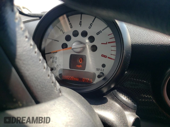 2012 MINI Convertible S with VIN WMWZP3C58CT296381, listed as a Copart auction lot 50834655 with 111,228 mi miles and Salvage Title. Bid and sale history available at DreamBid. Image 9.