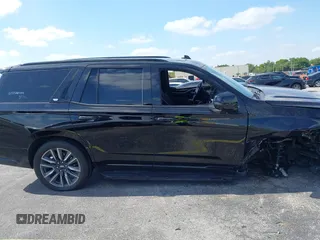 2023 Cadillac Escalade 4WD Sport z VIN 1GYS4EKLXPR513435, wystawiony jako IAAI lot #42137452 z przebiegiem 27 495 mil mil oraz . Historia ofert i sprzedaży dostępna na DreamBid. Obrazek 14.