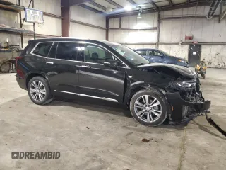 2020 Cadillac XT6 FWD Premium Luxury with VIN 1GYKPCRSXLZ154638, listed as a Copart auction lot 57439835 with 142,435 mi miles and Salvage title. Bid and sale history available at DreamBid. Image 4.