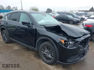 2021 Mazda CX-5 Touring with VIN JM3KFACM5M0314557, listed as a IAAI auction lot 41778401 with 31,938 mi miles. Bid and sale history available at carsss.com. Image 1.