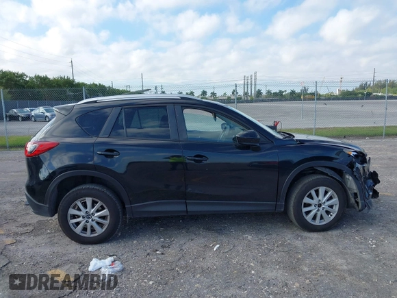 2014 Mazda CX-5 Touring with VIN JM3KE2CYXE0384987, listed as a IAAI auction lot 42052196 with 151,765 mi miles. Bid and sale history available at carsss.com. Image 13.