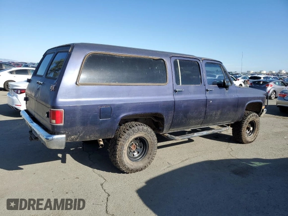 1991 GMC Suburban z VIN 1GKEV16K9MF510909, wystawiony jako Copart lot #81326004 z przebiegiem 216 778 mil mil oraz Tytuł czysty. Historia ofert i sprzedaży dostępna na DreamBid. Obrazek 3.