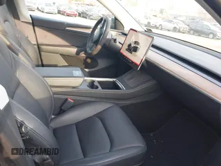 2023 Tesla Model Y Long Range with VIN 7SAYGAEEXPF612231, listed as a IAAI auction lot 41758243 with 32,924 mi miles and . Bid and sale history available at DreamBid. Image 5.