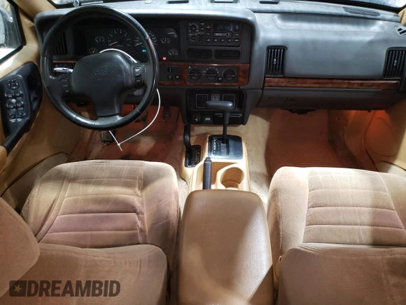 1997 Jeep Grand Cherokee Laredo with VIN 1J4GZ58S6VC573007, listed as a Copart auction lot 42728355 with 164,269 mi miles and Salvage Title. Bid and sale history available at carsss.com. Image 8.